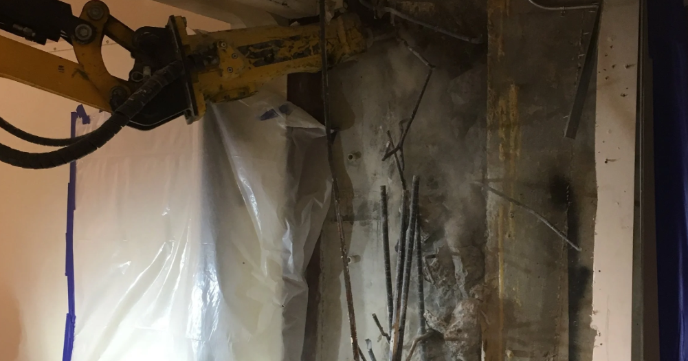 Selective structural demolition with remote-controlled robot (5)